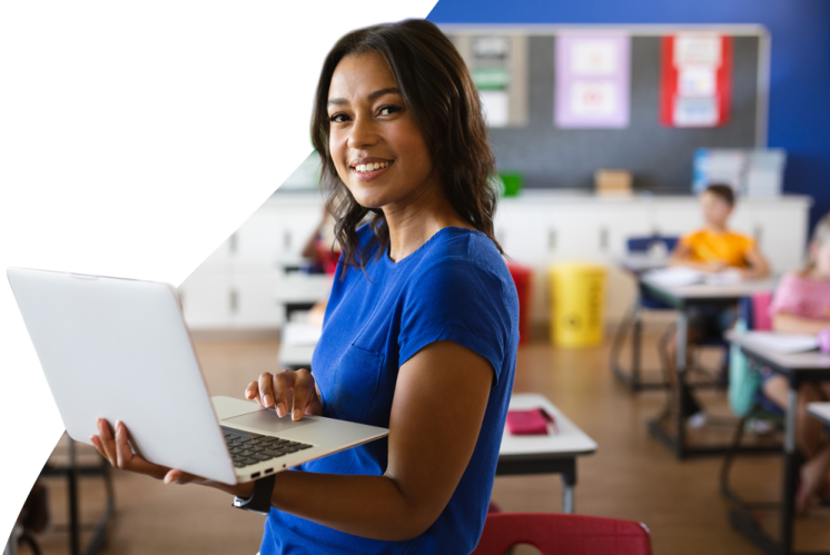 a woman holding a laptop computer