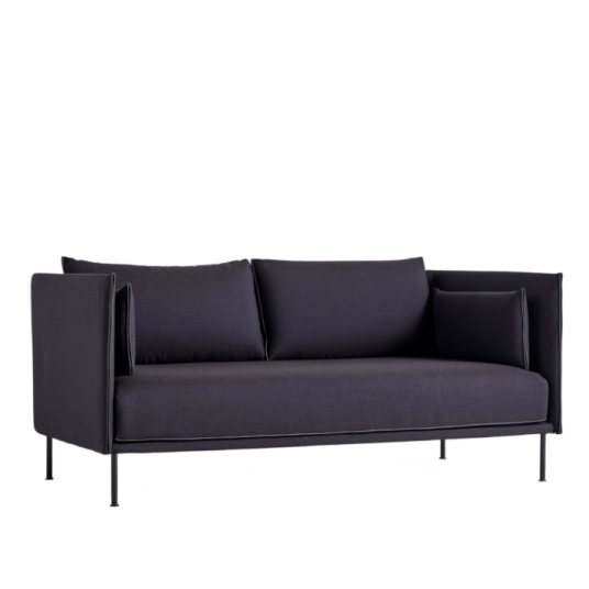 a black sofa with two pillows on it