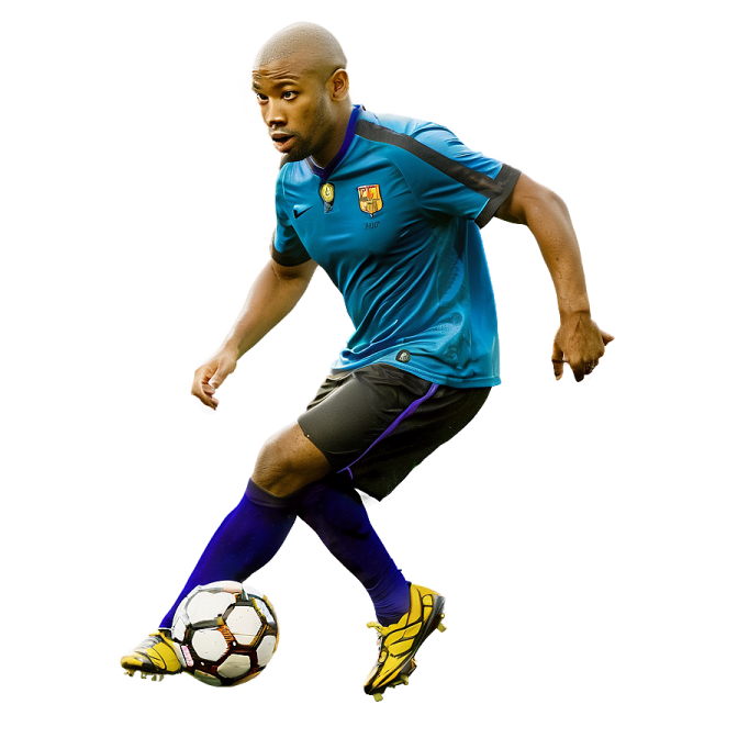 a man in a blue shirt kicking a soccer ball