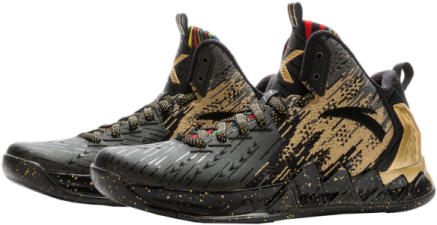 a pair of black and gold basketball shoes