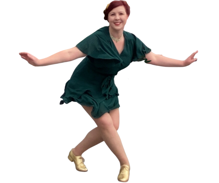 a young girl in a green dress is dancing