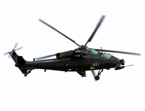 a black helicopter flying through the air