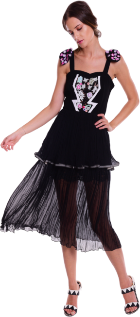 a woman in a black dress with flowers on it
