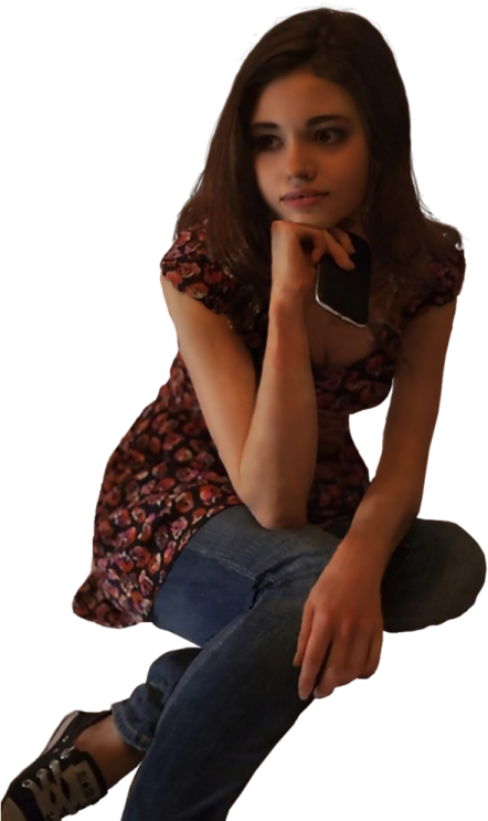 a woman sitting on the ground with her hand on her chin