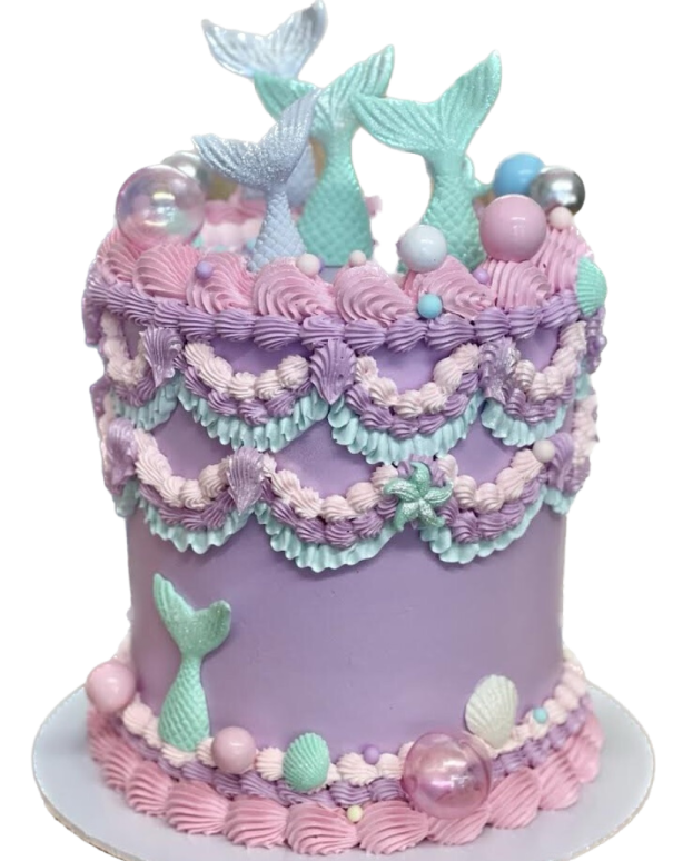 a purple and blue cake with mermaids on top