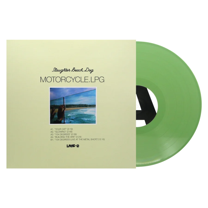 a green vinyl record with an image of a man on the beach