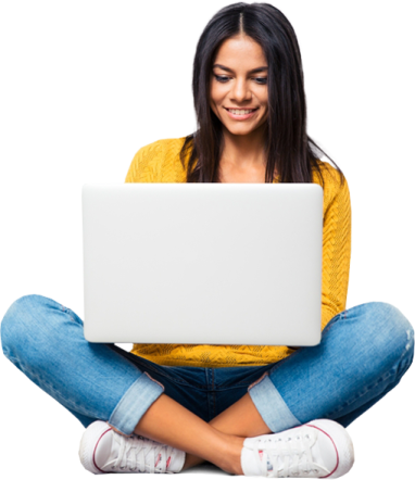 a woman sitting on the floor with her laptop