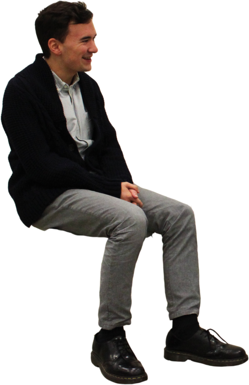 a man sitting on top of a stool