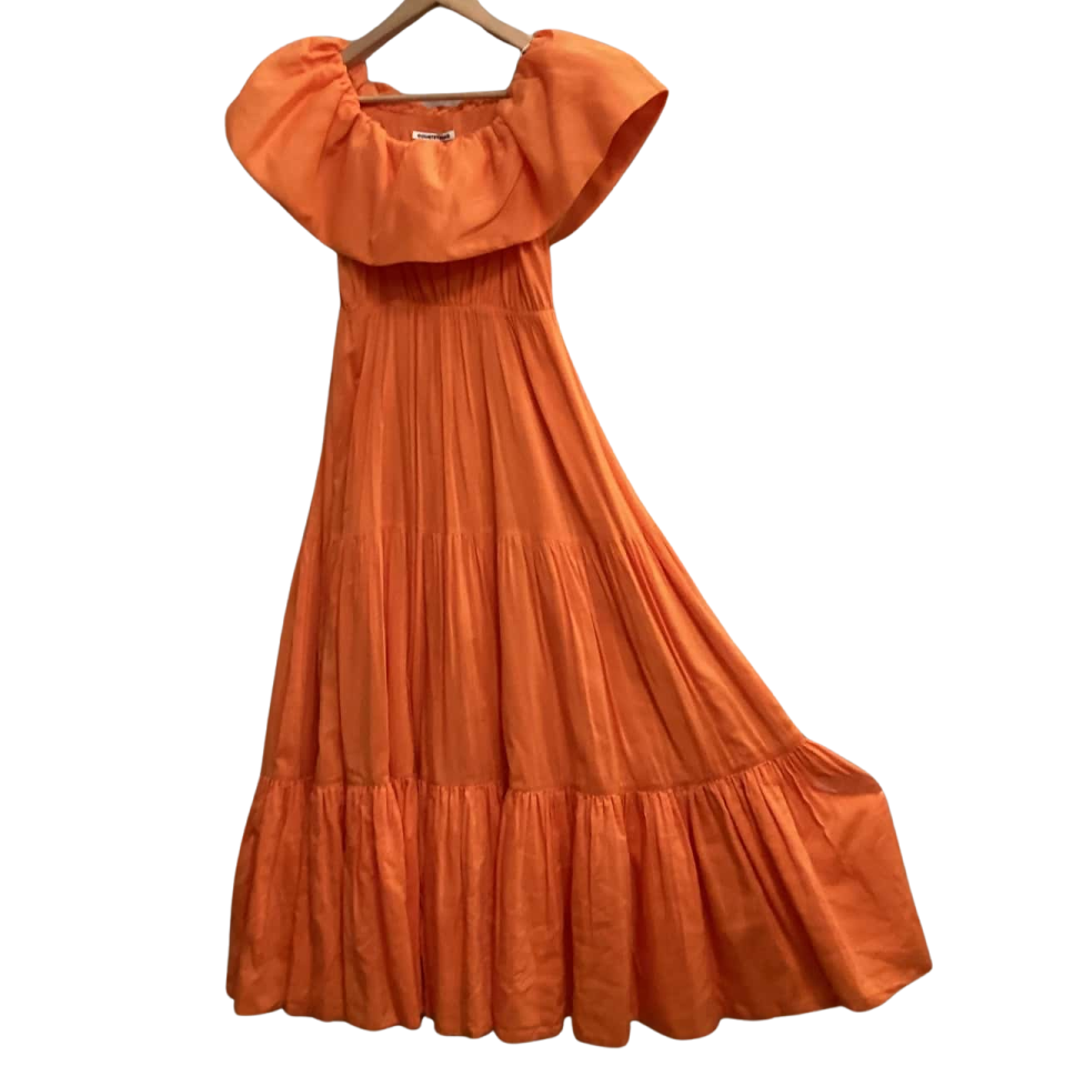 an orange dress on a hanger