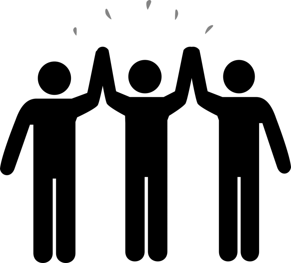 three people holding hands in a circle