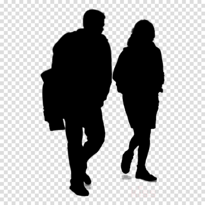 a silhouette of two people walking down the street