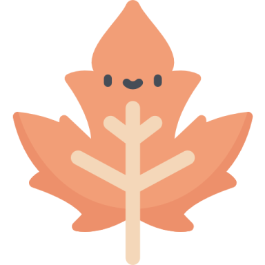 an orange maple leaf with a smiley face