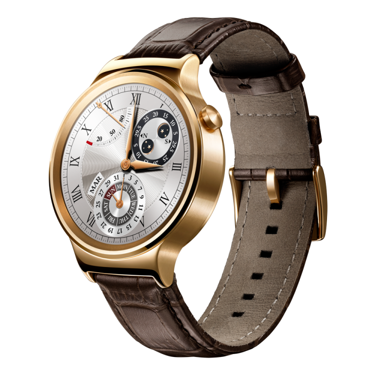 a gold watch with brown leather strap