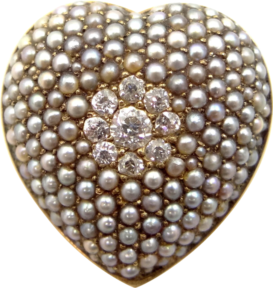 a heart shaped pearl and diamond ring