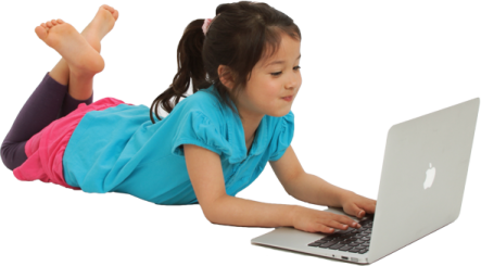 a little girl laying on the floor with her laptop