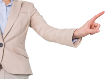 a woman in a business suit is pointing at something