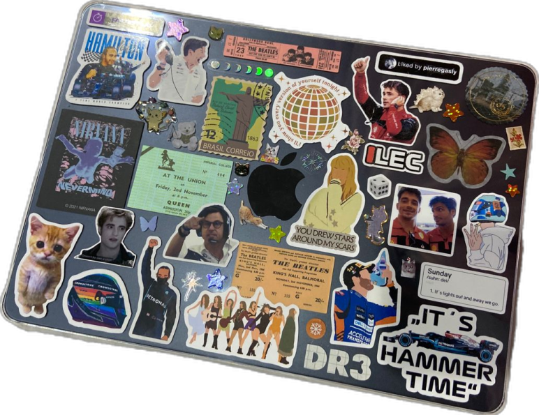 a laptop with many stickers on it