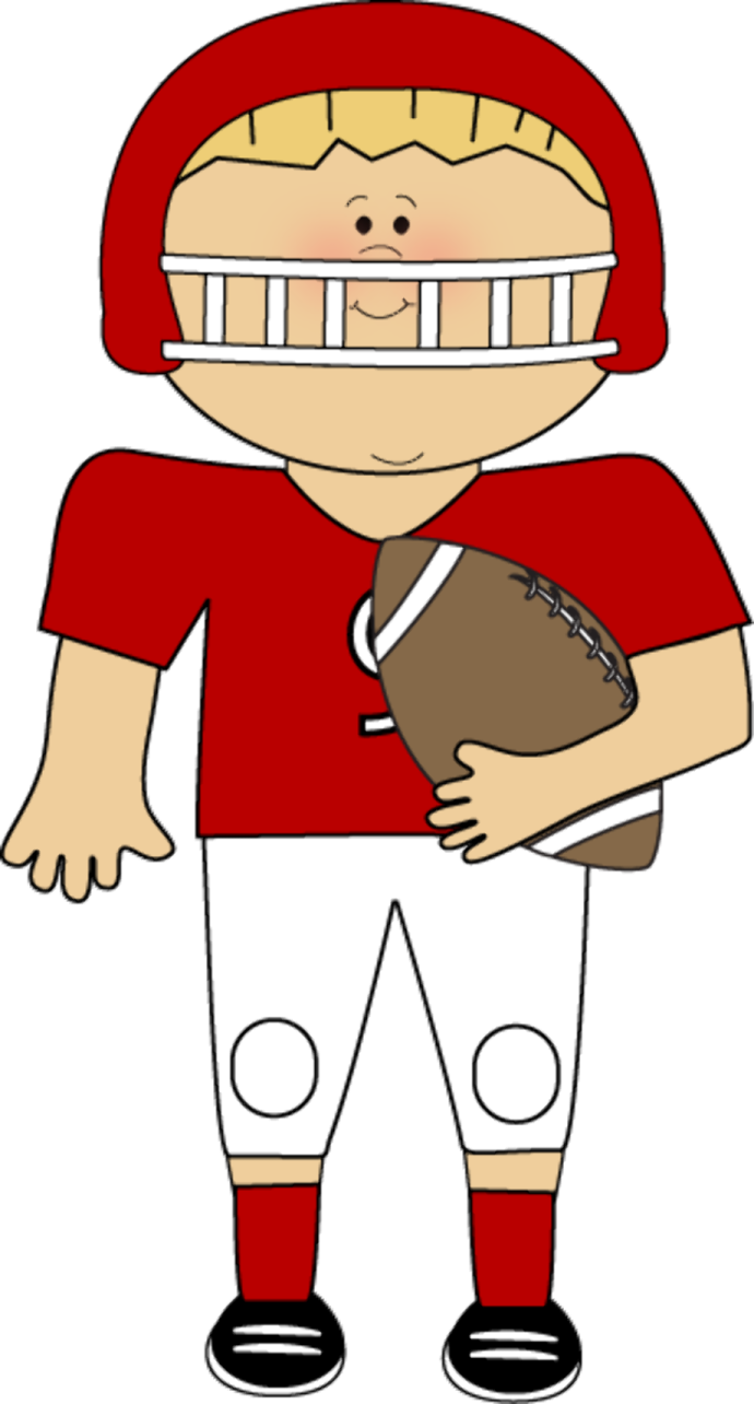 a boy in a football uniform holding a ball
