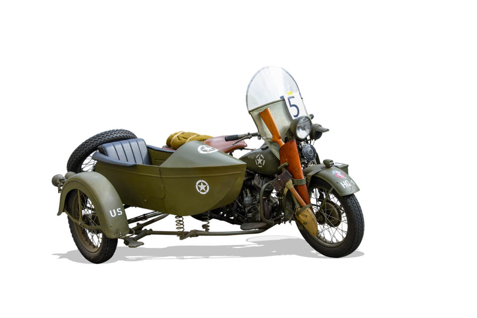 an old motorcycle with a sidecar attached to it