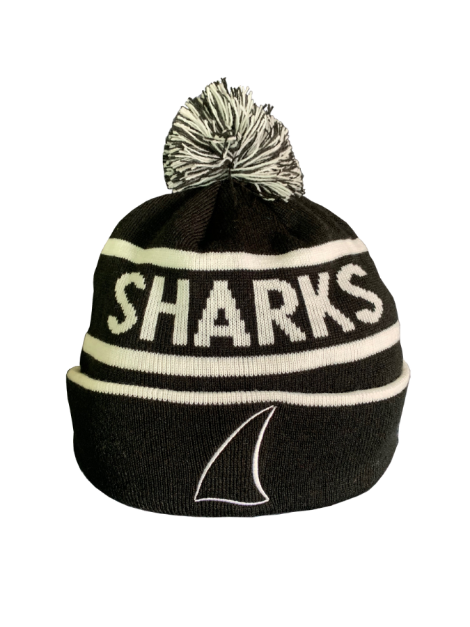 a black and white knit beanie hat with the word sharks on it