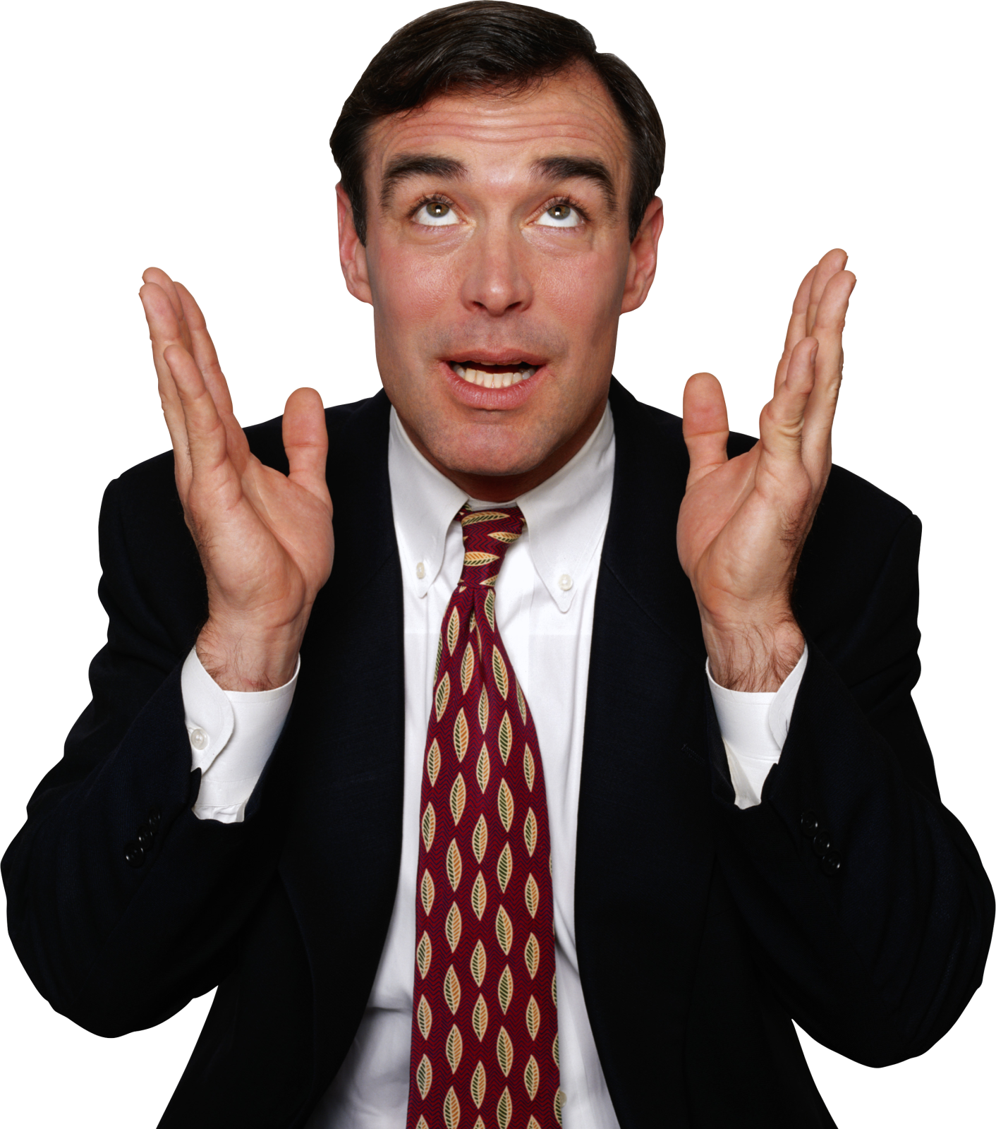 a man in a suit and tie holding his hands up