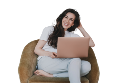 a woman sitting in a chair with her laptop