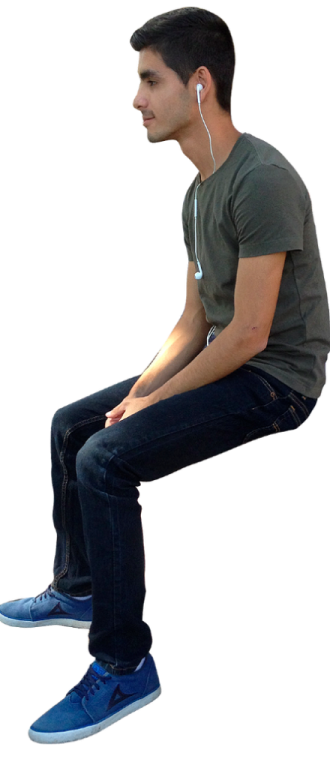 a man is sitting down with his headphones on