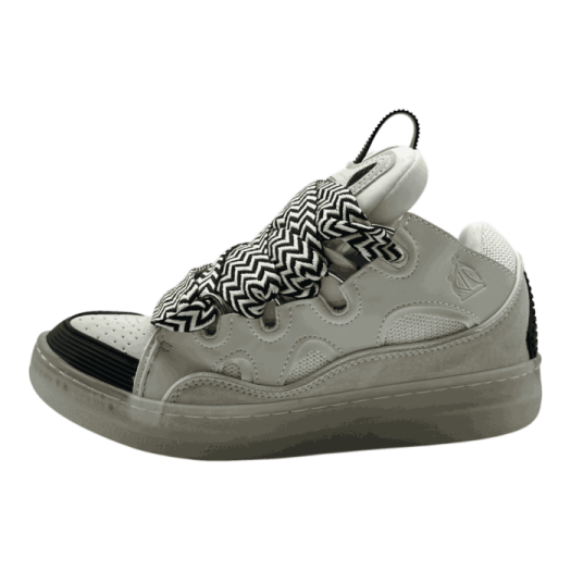 a pair of sneakers with black and white patterns