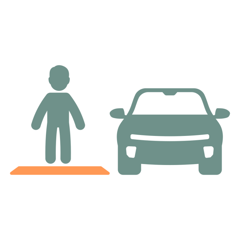 a person standing next to a car