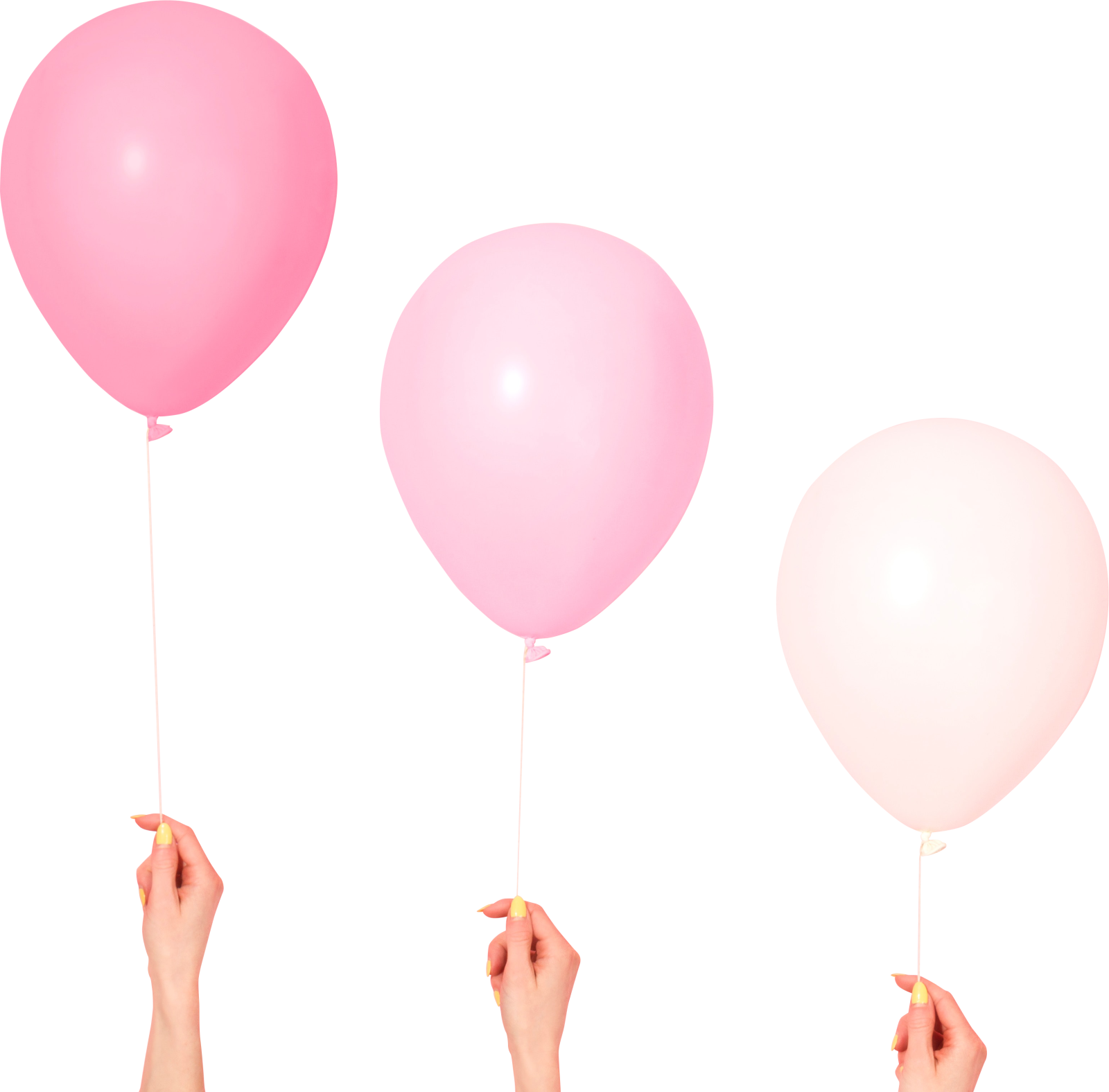 a hand holding three balloons in different colors
