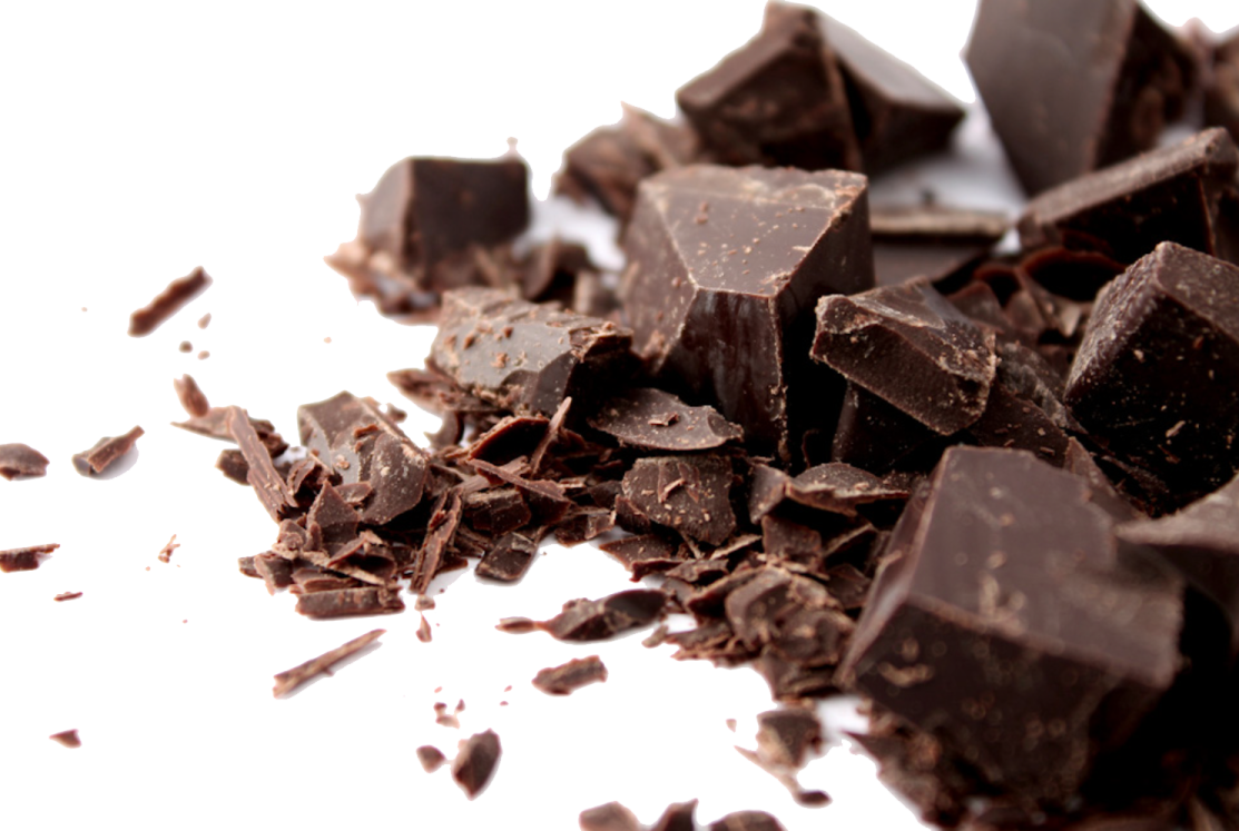 a pile of chocolate on a white surface
