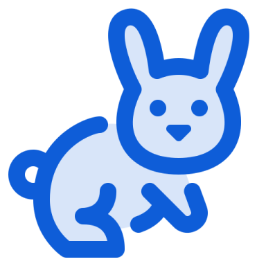 a blue rabbit sitting down on the ground