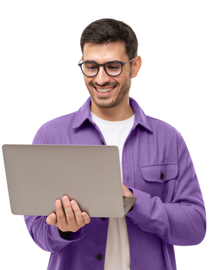 a man in a purple jacket holding a laptop