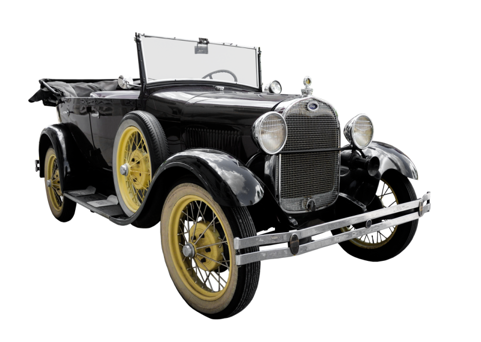 an old black and yellow car on a white background