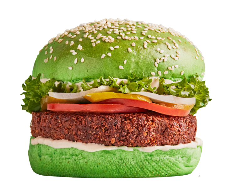 a large hamburger with meat and vegetables on it