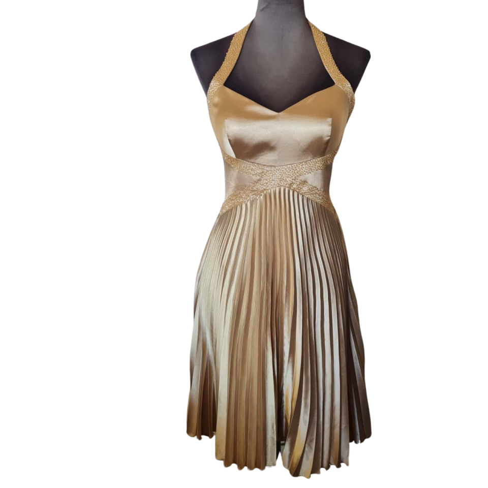 a brown and beige dress on a manne