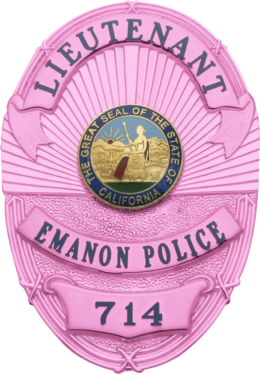 a pink police badge with the name of an officer