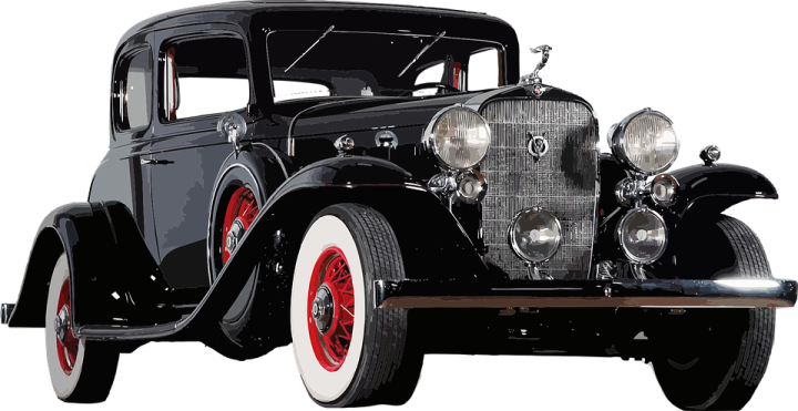 an old black car with red rims