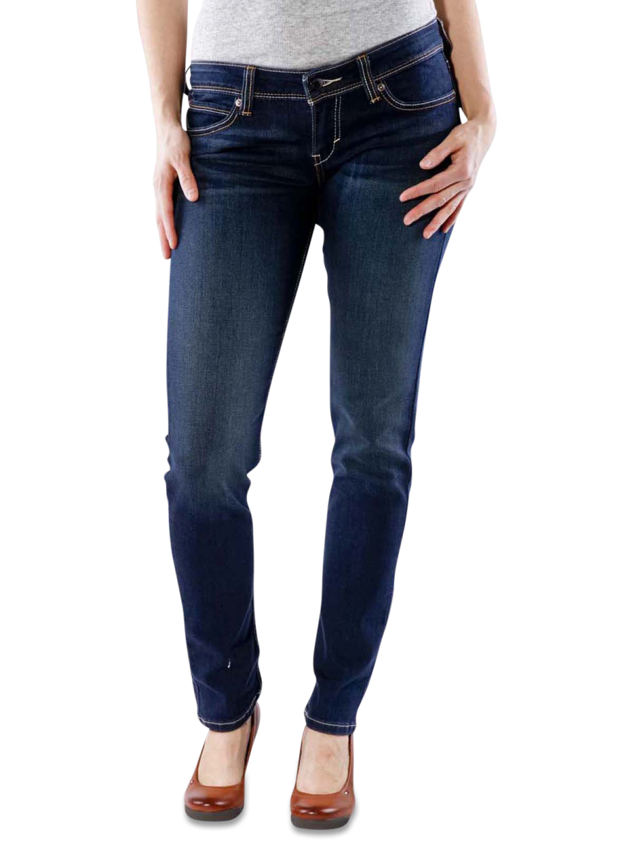 a woman wearing jeans and heels