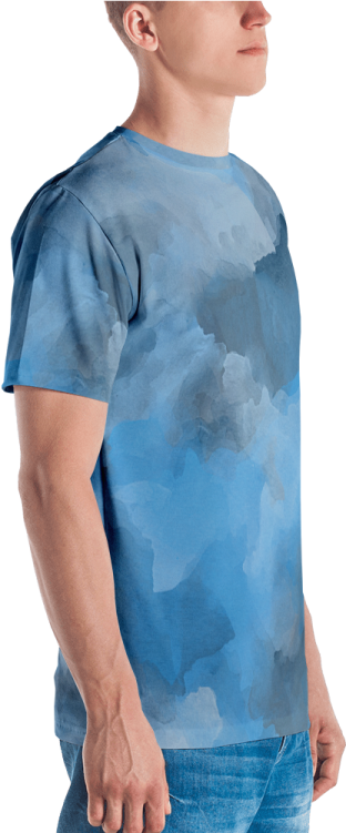 a man wearing a blue t - shirt with clouds on it