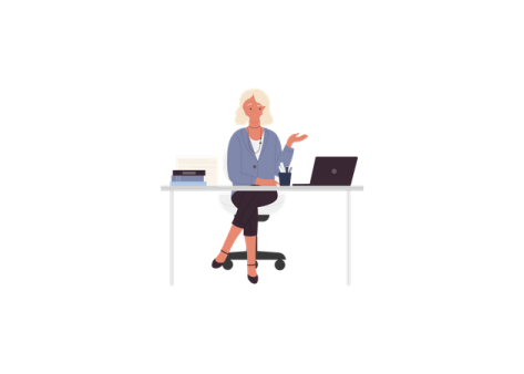 a person sitting at a desk with a laptop