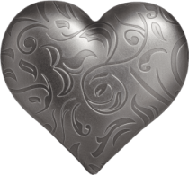 a heart shaped metal object on a white background