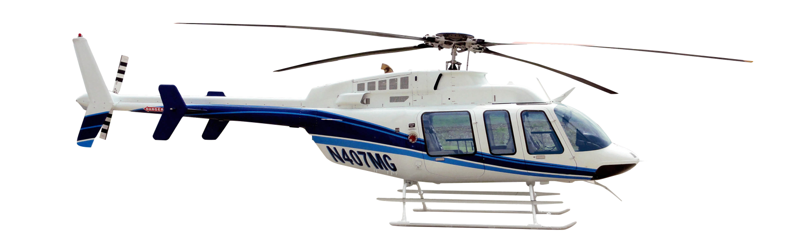 a white and blue helicopter flying in the sky