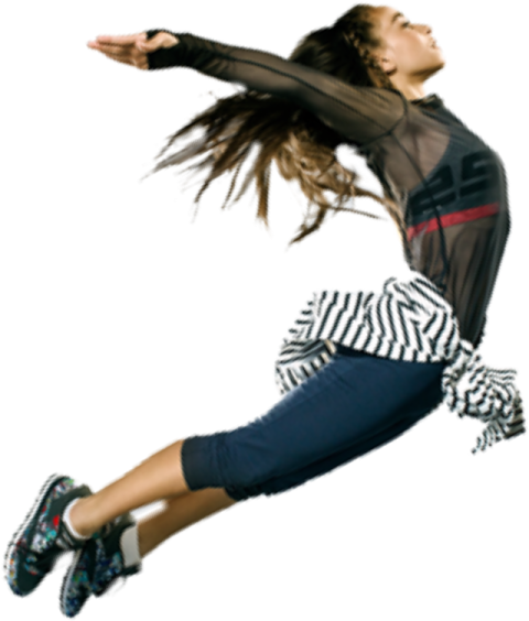 a young woman is jumping in the air