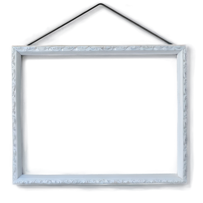 a white picture frame hanging on a wall