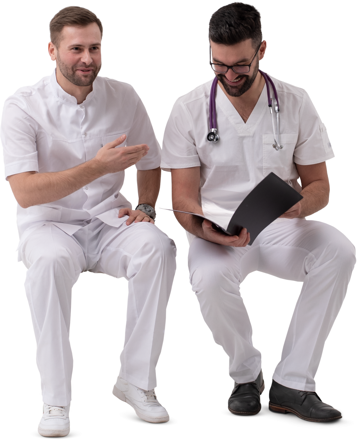 two male doctors sitting on a white surface