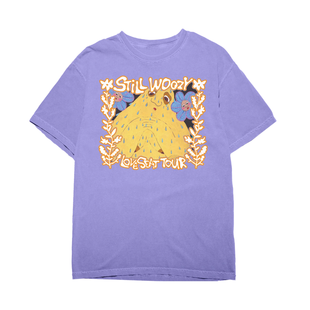 a purple t - shirt with a cartoon character on it