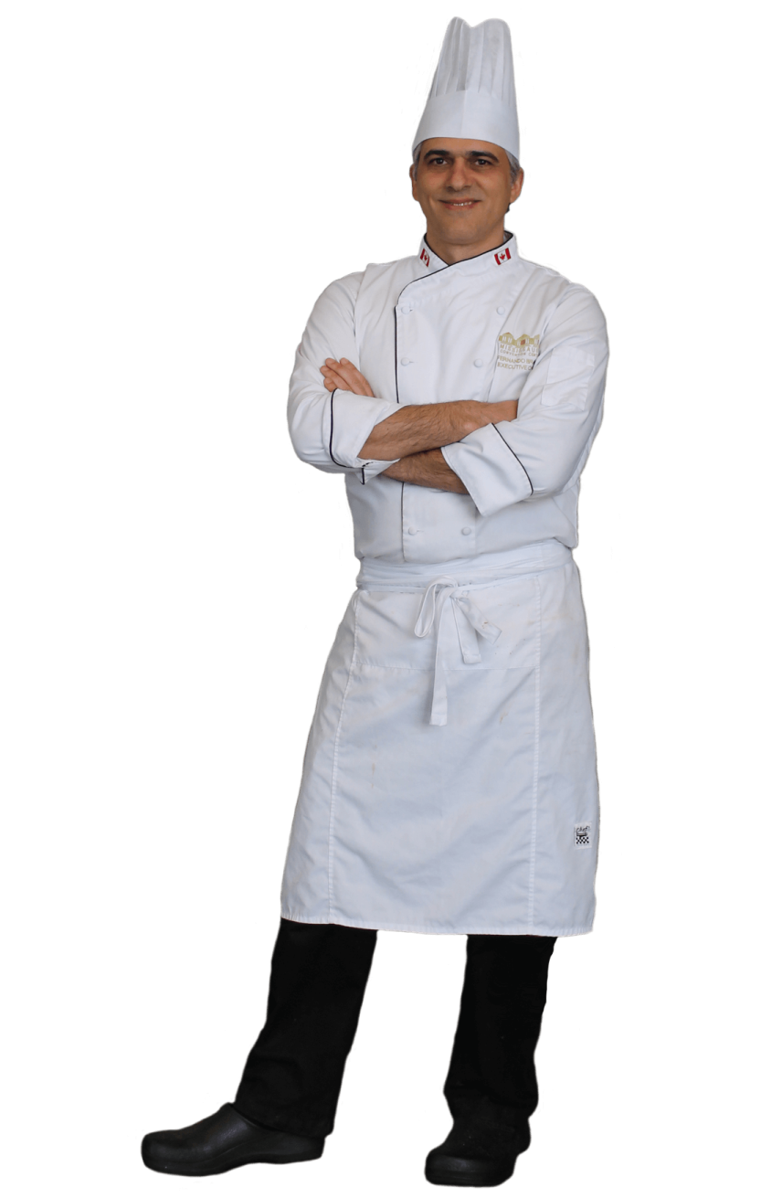 a chef standing with his arms crossed