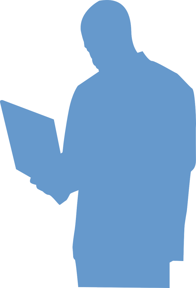 a silhouette of a man holding a laptop