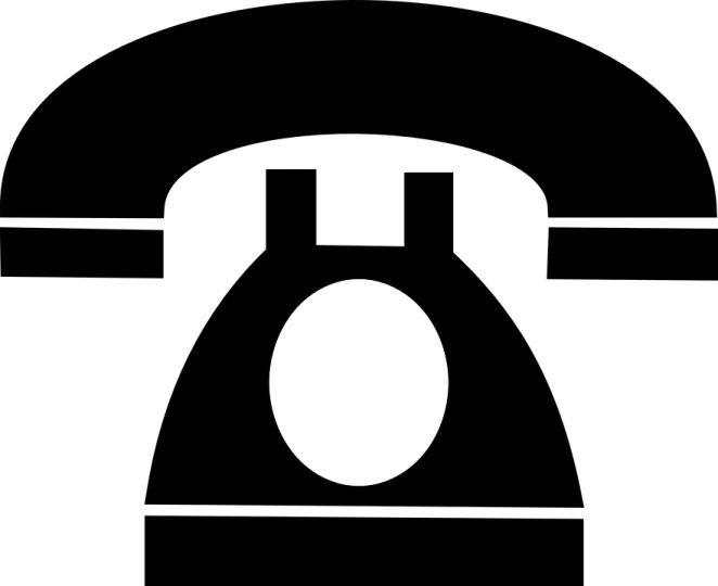 a black and white image of an old phone